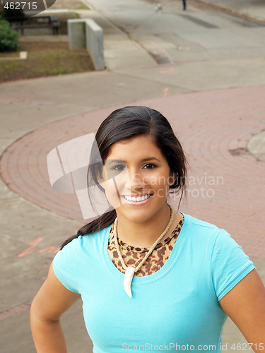 Image of Young hispanic teen girl smiling outdoor portrait