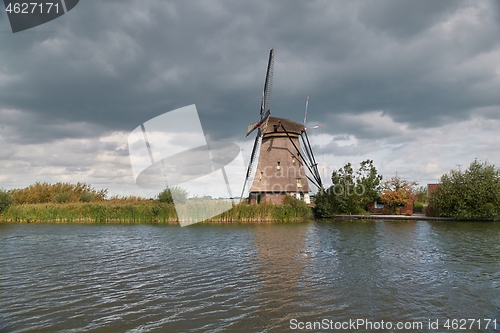 Image of Windmill beside a canal