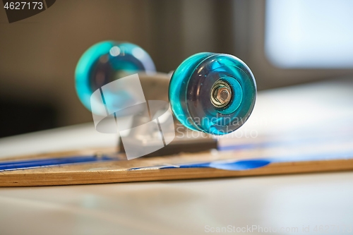 Image of Skateboard on a table, wheel closeup focus