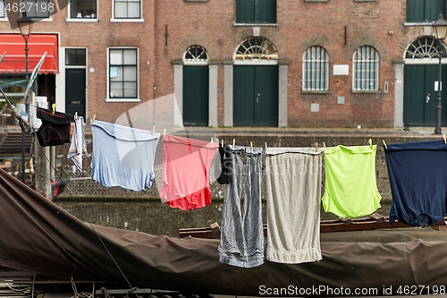 Image of Clothes Hanging Outside near a canal