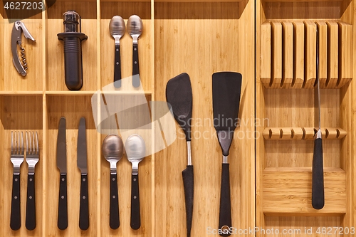 Image of Minimalist kitchen tools put away in a drawer