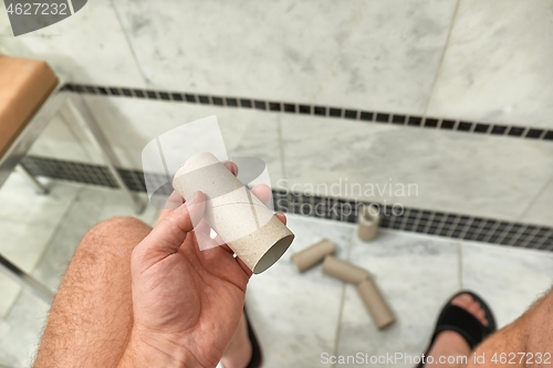 Image of Finding empty roll in the restroom