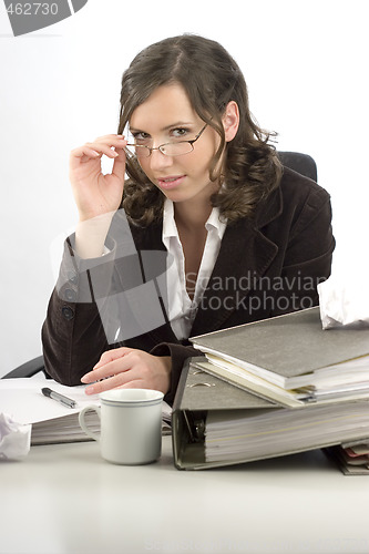 Image of Young businesswoman at desktop