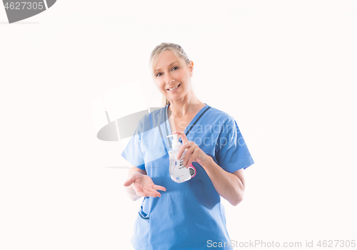 Image of Nurse holding and demonstrating hand hygiene alcohol rub