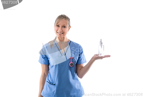 Image of Nurse holding hand sanitizer or other product in palm of hand