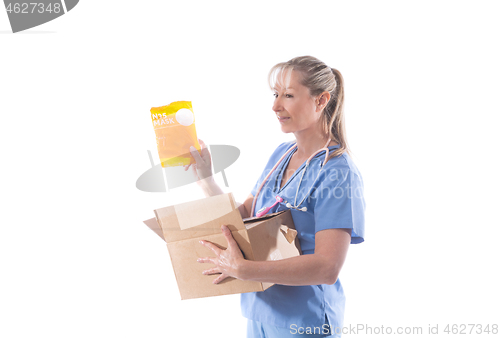 Image of A nurse holds a box of N95 respirator masks