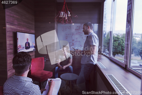 Image of start up business people group attending videoconference call