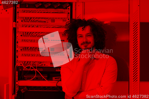 Image of business man engeneer in datacenter server room