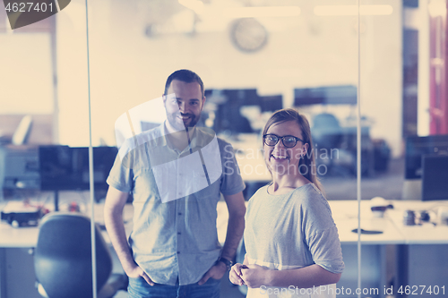 Image of business couple at office