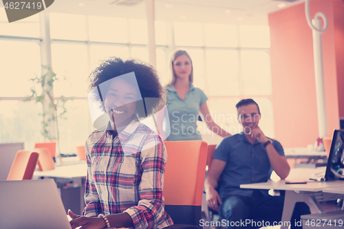 Image of African American informal business woman working in the office