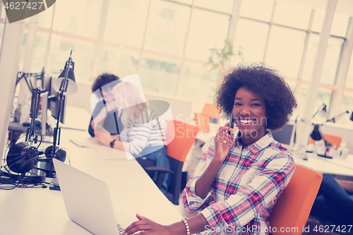 Image of African American informal business woman working in the office