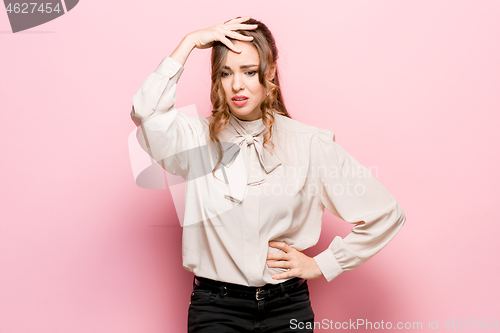 Image of Young serious thoughtful business woman. Doubt concept.