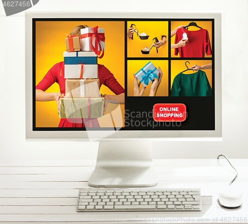 Image of Internet online shopping concept with computer and cart