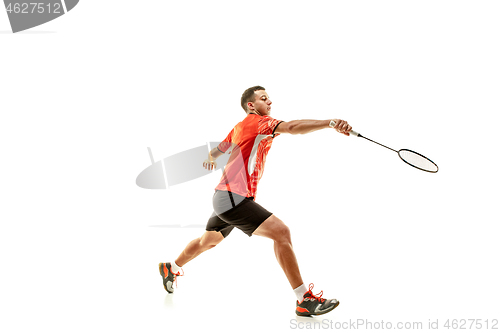 Image of Young male badminton player over white background