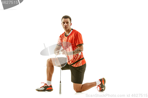 Image of Young male badminton player over white background