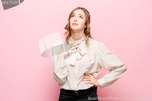 Image of Serious unhappy female has appealing appearance, being sad after quarrel