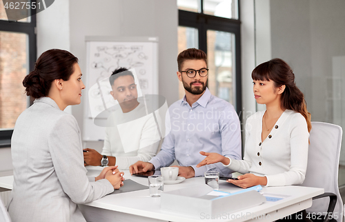 Image of recruiters having job interview with employee