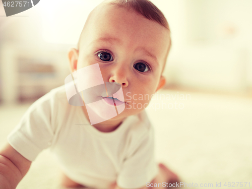 Image of close up of happy little baby boy or girl at home