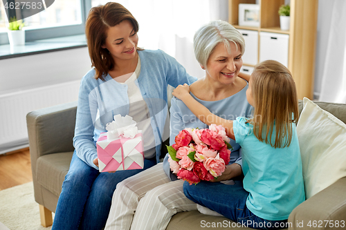 Image of granddaughter hugging and greeting grandmother