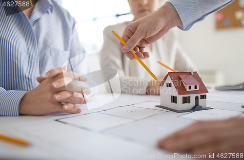 Image of close up of architects discussing house project