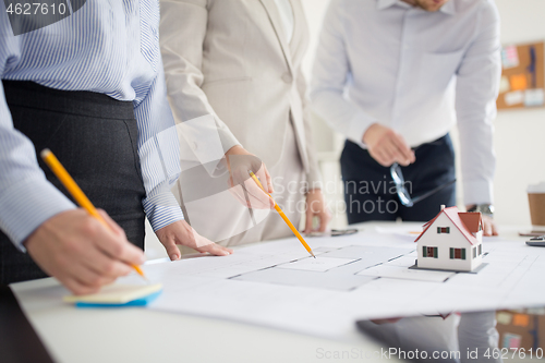 Image of close up of architects discussing house project
