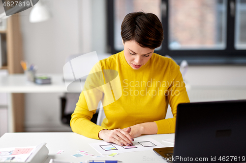 Image of ui designer working on user interface at office