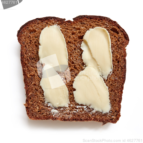 Image of slice of rye bread with butter