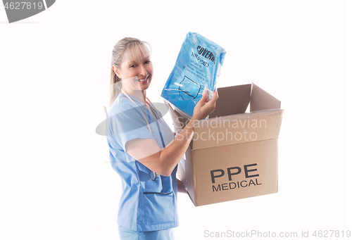 Image of Nurse or doctor holding a Category 3 Coverall PPE for infection 