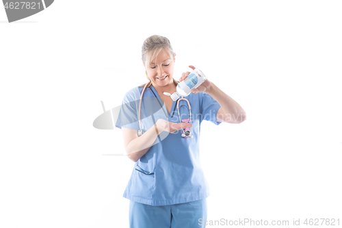 Image of Nurse using or demonstrating hand sanitizer