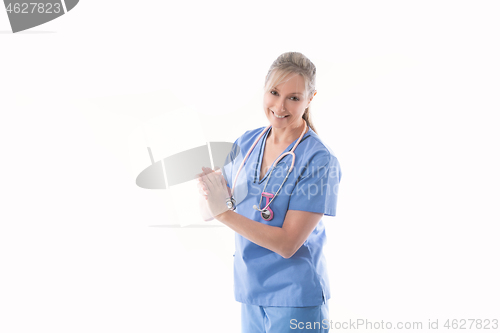 Image of Friendly nurse using an alcohol hand sanitizer