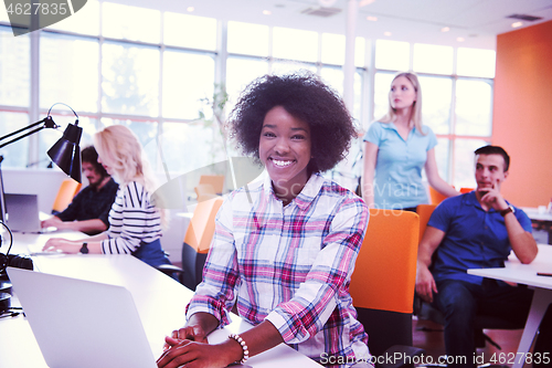 Image of African American informal business woman working in the office