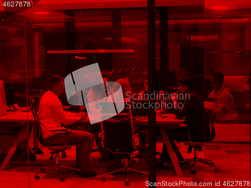 Image of Startup Business Team At A Meeting at modern night office buildi