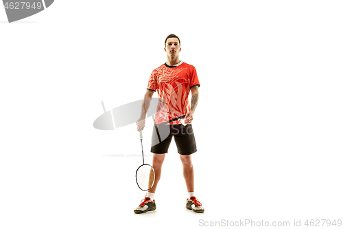 Image of Young male badminton player over white background