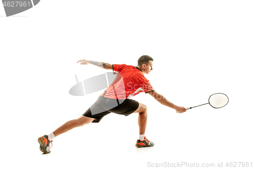 Image of Young male badminton player over white background