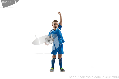 Image of Young boy with soccer ball doing flying kick