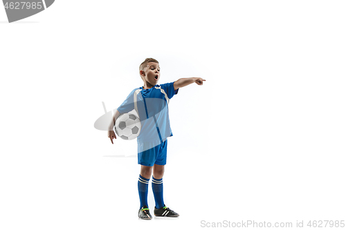 Image of Young boy with soccer ball doing flying kick