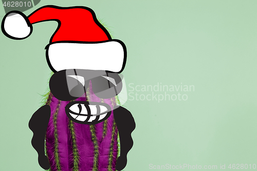 Image of Cactus hipster man with santa hat. Tropical Christmas concept. Minimal fun art