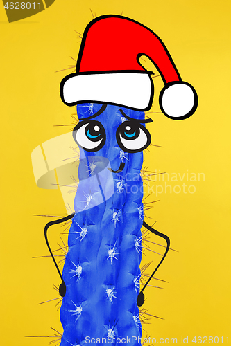 Image of Cactus hipster man with santa hat. Tropical Christmas concept. Minimal fun art