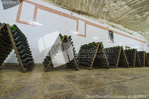 Image of Storage hall of white sparkling wine bottles