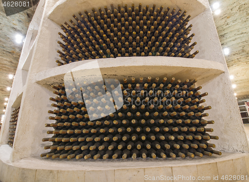 Image of Wine bottle in a row, winery cellars