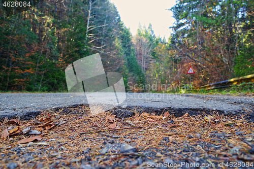 Image of Asphalt road hole damage