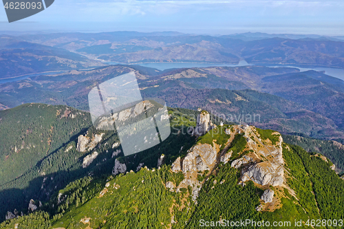 Image of Drone view, mountain peak, forest and lake arround