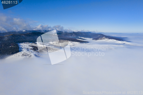 Image of Morning mountain landscape with low clouds