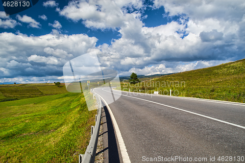 Image of Highway road on summer hill