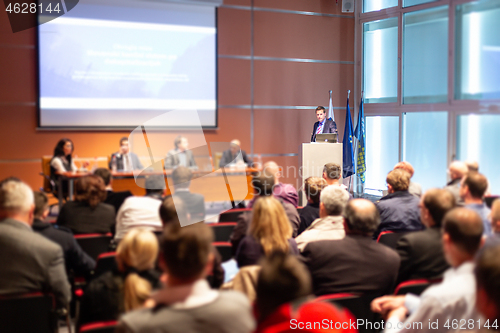 Image of Speaker giving presentation on scientific business conference.