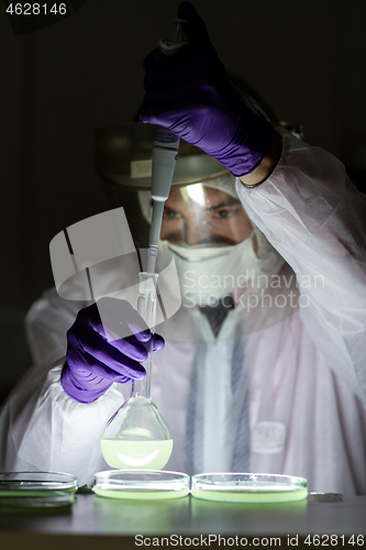 Image of Scientist working in corona virus vaccine development laboratory research facility.