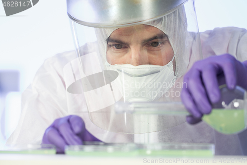 Image of Scientist working in corona virus vaccine development laboratory research facility.