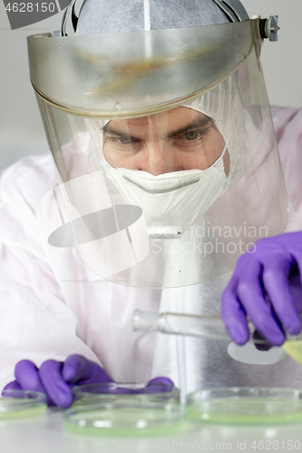 Image of Scientist working in corona virus vaccine development laboratory research facility.