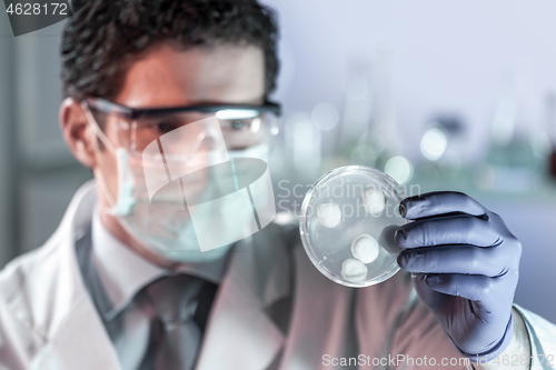 Image of Scientist working in corona virus vaccine development laboratory research facility.