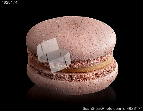 Image of Single beige macaroon angled view